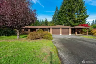 A 2-car garage plus a 2-car carport provide ample parking for multiple vehicles, plus space for storage, hobbies, or toys.