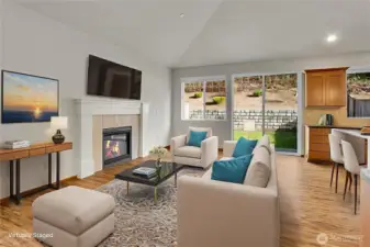 Cozy fireplace and lots of room to spread out in the Great Room. Virtually staged.