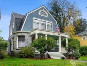 Gorgeous Victorian sits high up on large sunny lot!