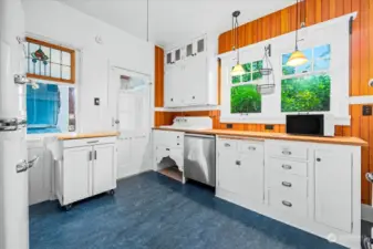 Thoughtfully updated kitchen with custom cabinetry and Marmoleum floors