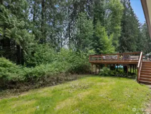 Approximately 3/4 acre of level grounds surround the home, offering plenty of space for outdoor activities, gardening, or simply relaxing in nature.