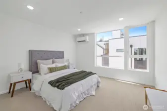 Spacious primary bedroom with ensuite bathroom! Model unit, finishes may vary.
