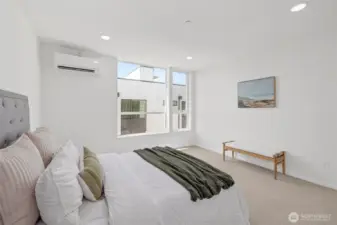 Spacious primary bedroom with ensuite bathroom! Model unit, finishes may vary.