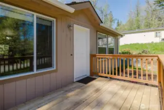 Treated wood deck front and back.