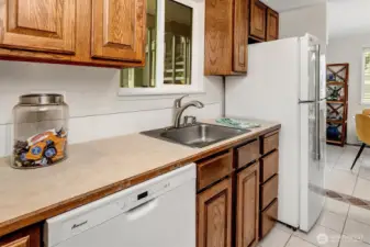 Kitchen window looks out to your carport.
