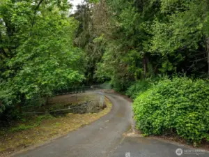 This short road leads to a walking path, it goes to the beach at Seahurst Park.