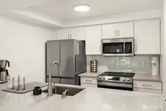 Modern, clean, functional kitchen - will make breakfast a breeze.