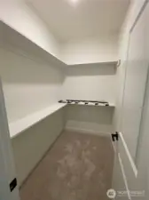 Walk-in closet for the primary bedroom.
