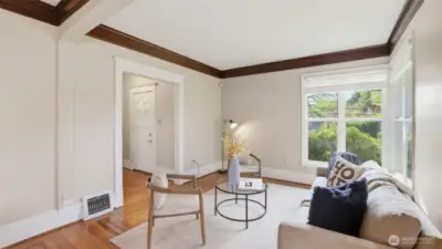 An airy living room filled with warmth, natural light, and timeless character.