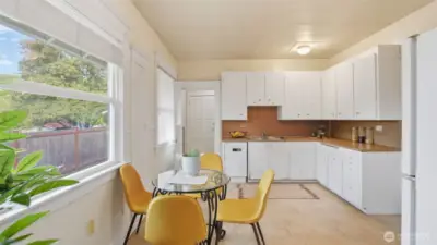 This kitchen blends charm and functionality with generous space and sunny dining.