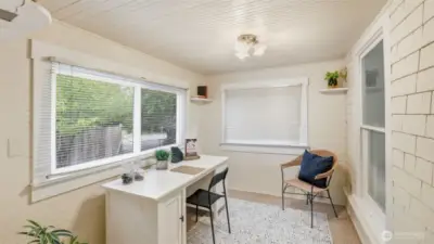 This sunlit flex space makes an inspiring home office or creative studio.