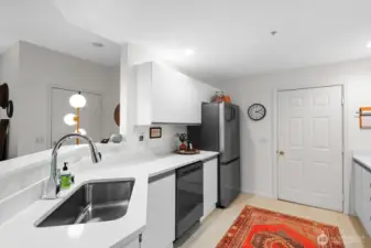 Deep sink, updated dishwasher and refrigerator. This kitchen has loads of counter and cabinet space!
