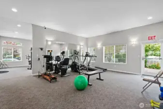 Light, bright workout space with bathrooms and a sauna.