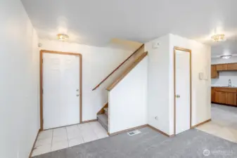 Front entry and stairs to upper floor