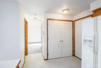 Doors to utility space and hall to powder bath