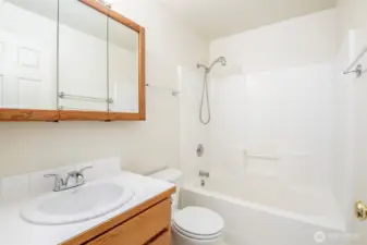 Secondary full bath on upper floor with new sink and faucet
