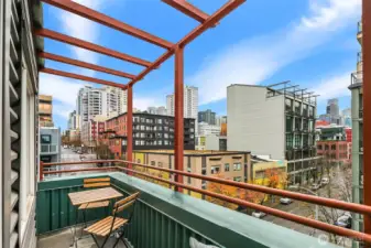 Large private patio off living space. Cool city and water view.