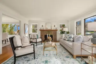 Living room adjacent to dining room with circular flow on main floor.