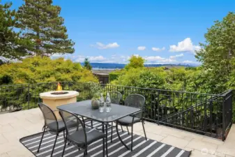 Deck and fireplace offer plenty of room for eating and lounging.
