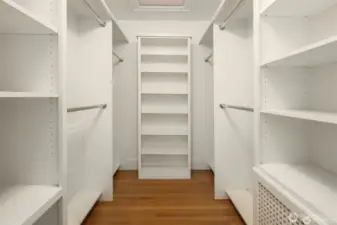 Primary walk-in closet with access to full size attic with tons of storage and flexible space to use for desk, or exercise.