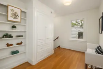 Upper level hallway with built-ins.
