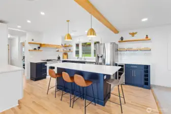 Oak flooring compliments the remodeled, open Kitchen. Intentionally done to maximize kitchen views.