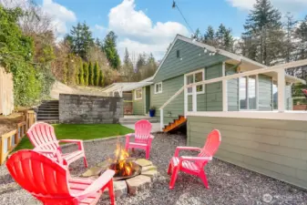 Enjoy the private backyard equipped with astro turf, fire fit, covered area and garden beds.