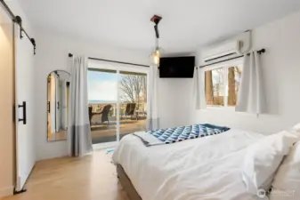 Enjoy this west facing bay view from your primary bedroom. Oak floors, walk in-closet and mini-split for AC/Heat.