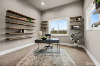 Home office in this Auburn River Rock home featuring a bright window, built in floating shelves, and a quiet layout ideal for remote work or study. This flexible room provides a comfortable workspace with natural light and peaceful neighborhood views.