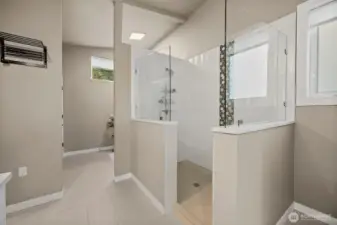 Primary bathroom walk in shower with glass enclosure