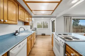 Kitchen with breakfast nook and wide vinyl plank flooring