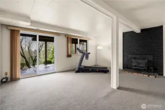 Brand new paint, carpet and a wood stove make this the perfect hang out space.