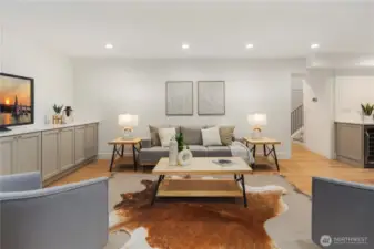 Tons of opportunity to create a fun space for everyone to gather...the palette in here is serene with the wide plank oak floors to the built in entertainment wall.