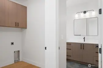 Upstairs laundry located near bathroom