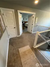 Upper floor hallway with view of front entry