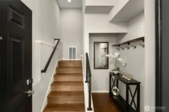 Gleaming hardwoods and spot for a shoe rack greet you upon entry