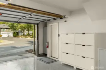 Garage has epoxy floors & built-in storage