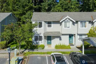 Unit #1, private corner lot, with 1 assigned carport parking, Space #65.