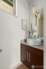 Convenient powder bath located on the main level with kitchen, dining, and living room