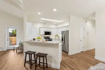 Dining peninsula with additional seating/dining space.