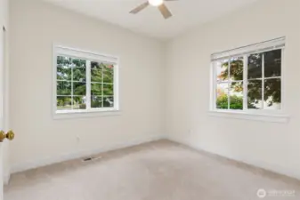 Bedroom 2 with new ceiling fan and full size closet.