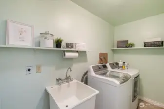 Spacious utility room conveniently located on main floor