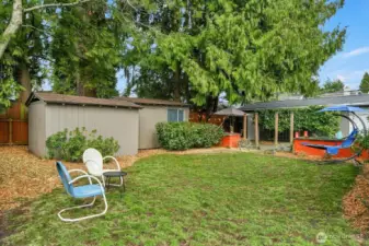 Lots of sunshine and 2 garden sheds for all your toys/tools.