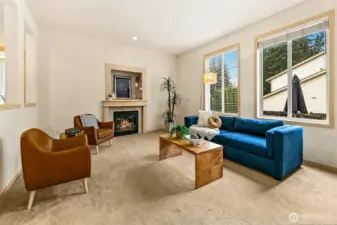 Family room anchored by a warm, inviting fireplace creates a central space for gathering and everyday life.