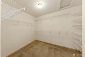 Primary walk-in closet offers generous storage and easy daily functionality.