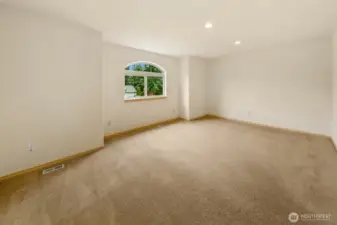 Versatile room suited for bedroom, media use, or dedicated home office.