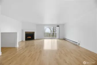 Living and dining area seamlessly flow together with private balcony just off the living room.