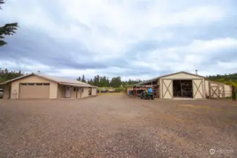 Garage with office space and ample storage and barn with many useful features for the working farm.