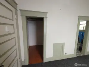 Main level bedroom with walk-in closet