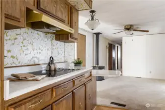 Kitchen is between the Dining room and Den/Family room